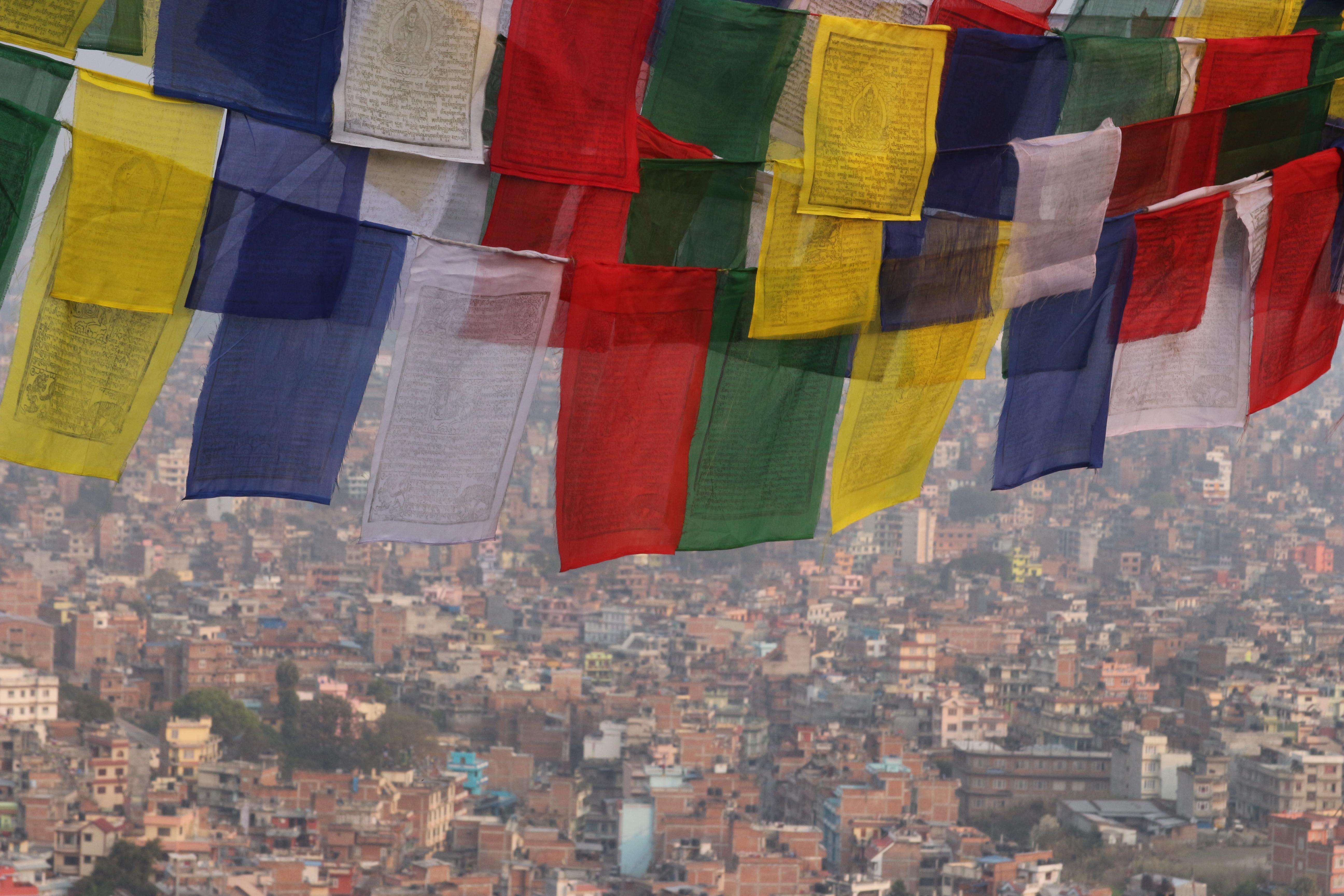 HIV/AIDS volunteers working in Nepal look at prayer flags. Projects Abroad HIV/AIDS volunteers in Nepal travel over the weekends and take a photo of prayer flags.